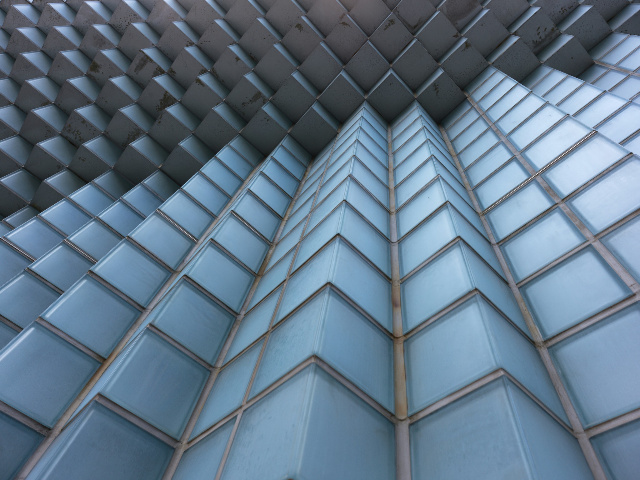 Geometric glass facade with repeating pattern